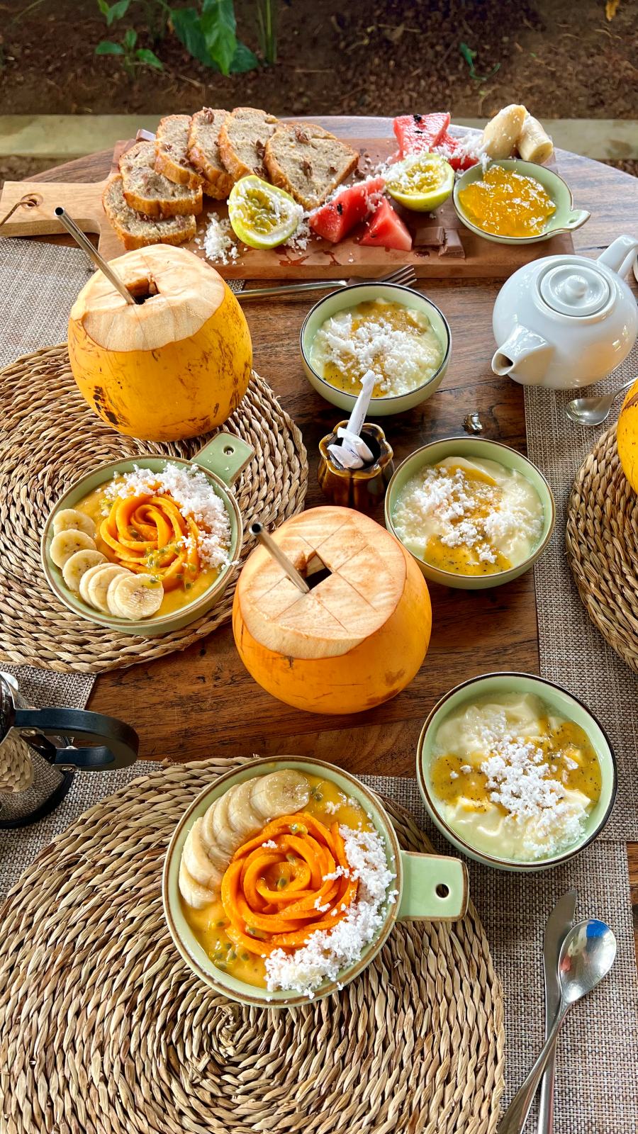 Tropical breakfast spread with coconuts and fruit