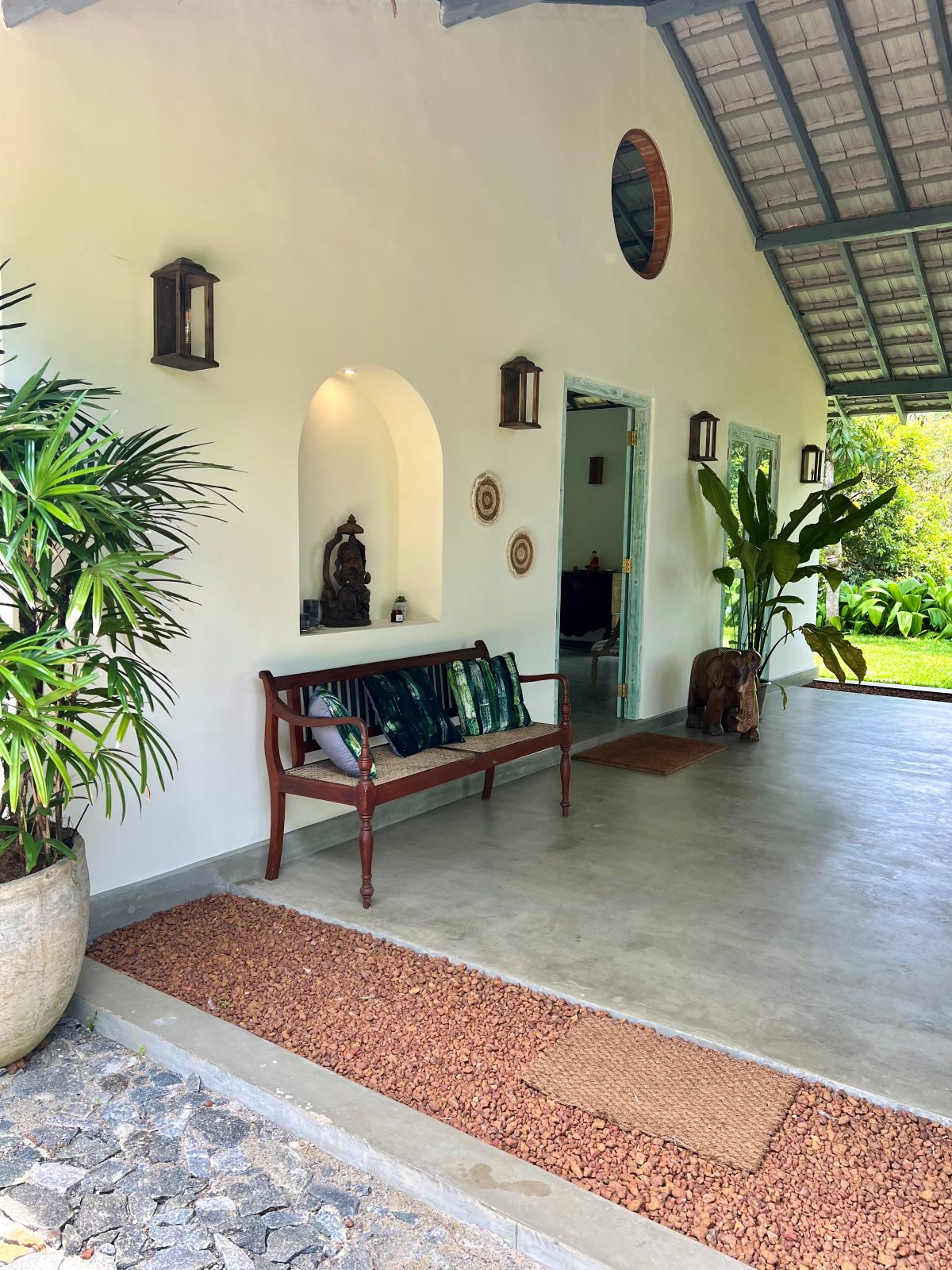 Open veranda with bench and tropical plants