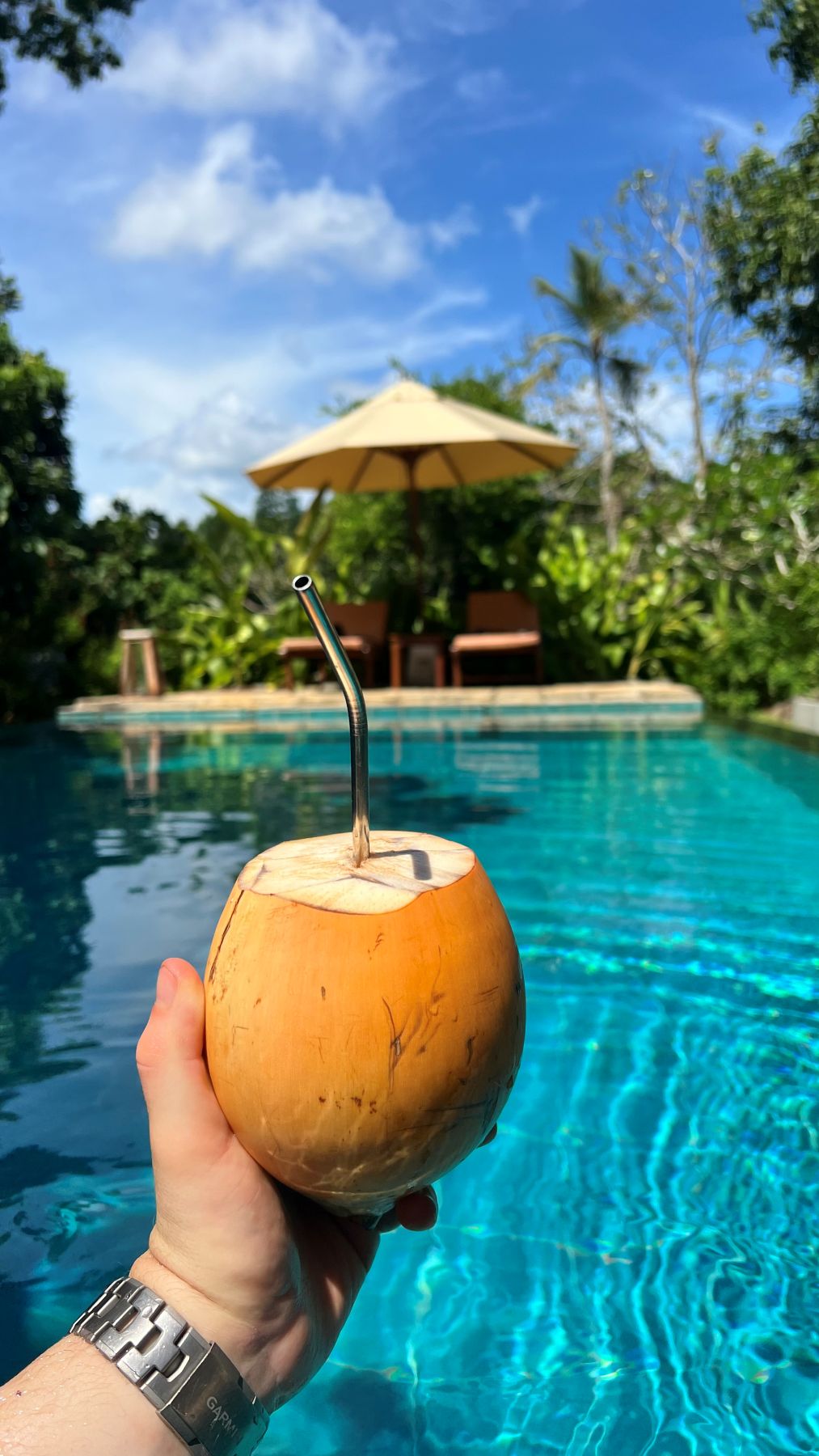 Welcome drink tray with frangipani by the pool